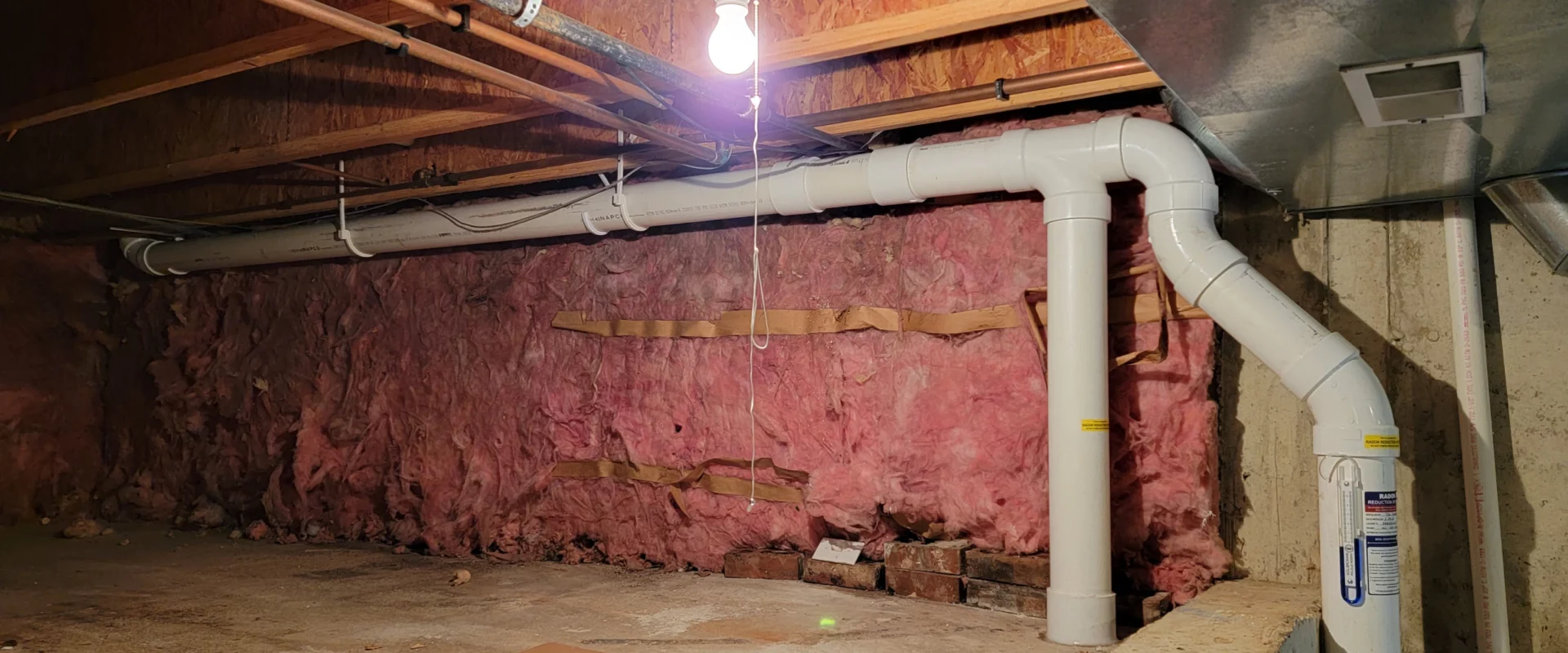 a radon mitigation system installed in the crawl space